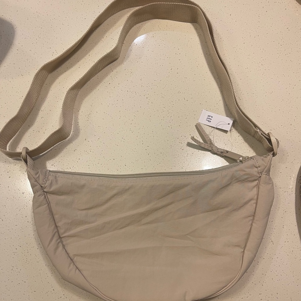 GAP Tan Crossbody Bag with Crescent Shape and Zipper Closure